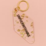 UNFUCKWITHABLE Motel Style Key Tag Keychain in Clear with Gold Leaf